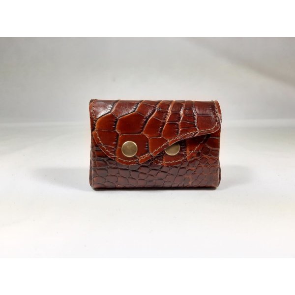 Retro-m&oslash;ntpung af trykt koskind.